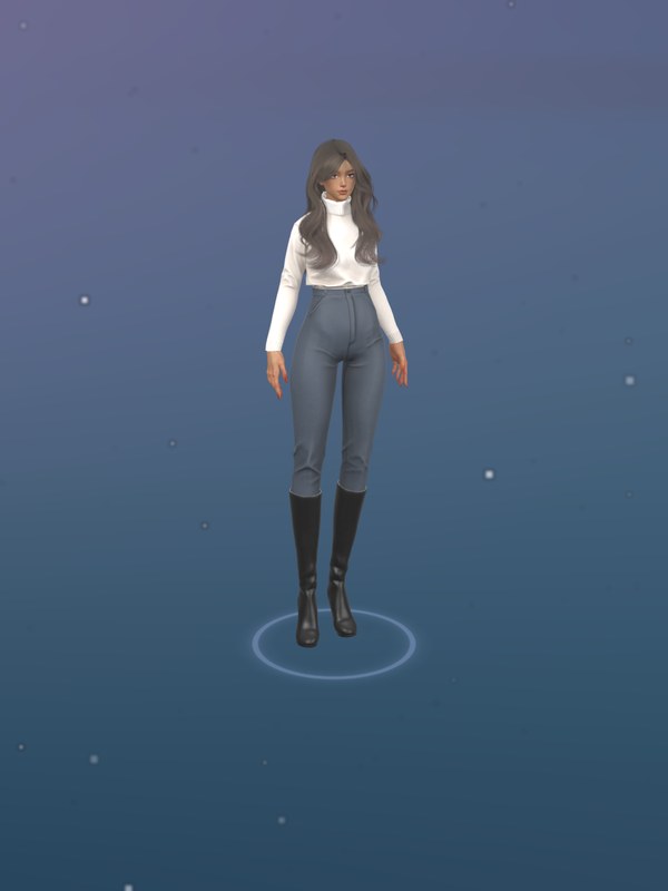 Jenna, standing on the stage in a white turtleneck and jeans